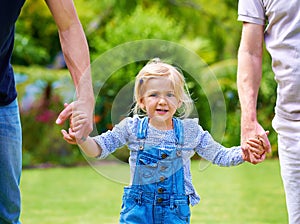 The young ones need our guidance. Portrait of a happy little girl holding the hands of her father and grandfather.