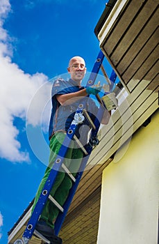 Young optimistic hipster renovates house