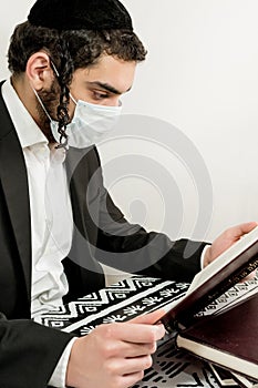 Young orthodox Jew with surgical mask