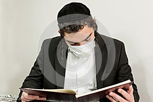 Young orthodox Jew with surgical mask photo