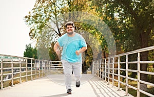 Young overweight man running. Fitness lifestyle