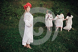 Young pagan Slavic girl conduct ceremony on Midsummer