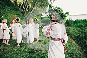 Young pagan Slavic girl conduct ceremony on Midsummer