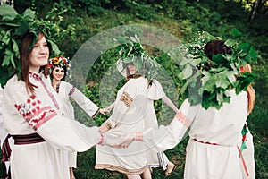 Young pagan Slavic girl conduct ceremony on Midsummer