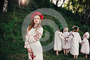 Young pagan Slavic girl conduct ceremony on Midsummer