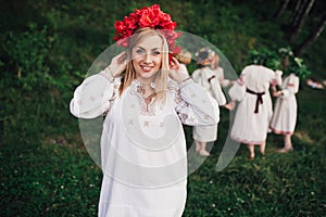 Young pagan Slavic girl conduct ceremony on Midsummer