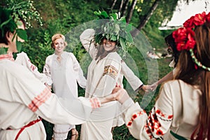 Young pagan Slavic girl conduct ceremony on Midsummer