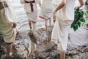 Young pagan Slavic girl conduct ceremony on Midsummer