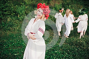 Young pagan Slavic girl conduct ceremony on Midsummer