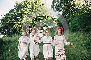 Young pagan Slavic girl conduct ceremony on Midsummer