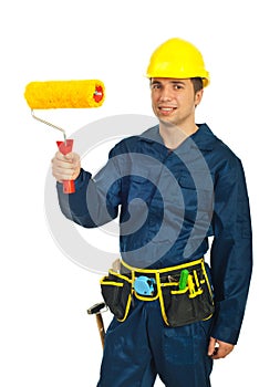 Young painter man holding paint roller