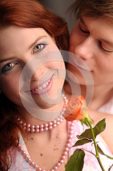 The young pair in love with rose