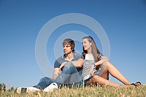 Young pair relax in park