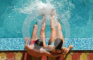 Young pair in water pool