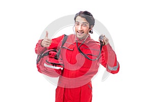 The young paramedic in red uniform isolated on white