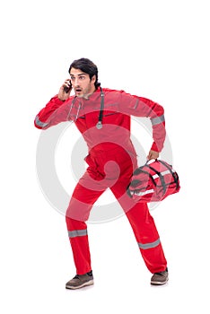 The young paramedic in red uniform isolated on white