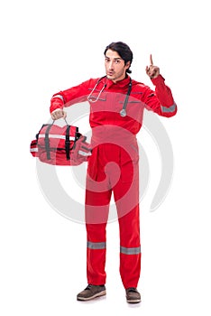 The young paramedic in red uniform isolated on white