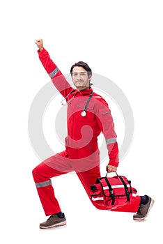 The young paramedic in red uniform isolated on white