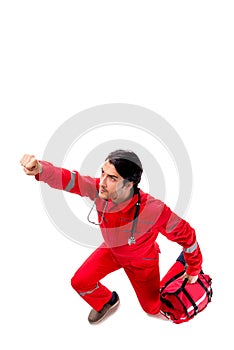 The young paramedic in red uniform isolated on white