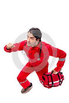 The young paramedic in red uniform isolated on white