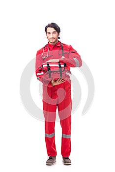 The young paramedic in red uniform isolated on white