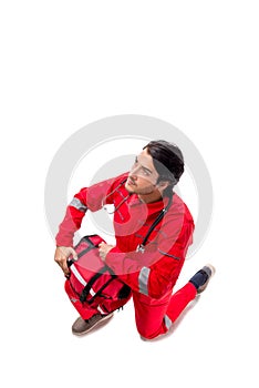 The young paramedic in red uniform isolated on white