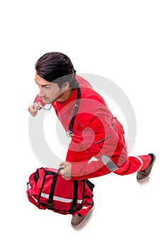 The young paramedic in red uniform isolated on white