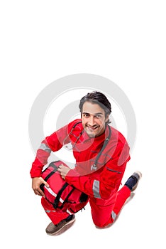 The young paramedic in red uniform isolated on white