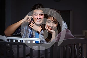 The young parents sleepless with newborn baby at night