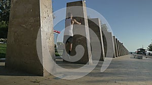 Young Parkour Tracer Making Wallflip