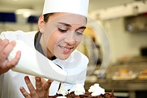 Young pastry cook at work