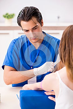 The young patient during blood test sampling procedure