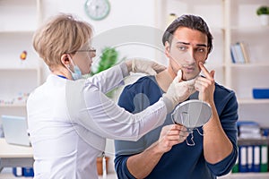 Young patient visiting doctor in hospital