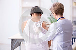 Young patient visiting doctor in hospital