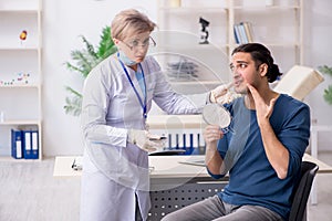 Young patient visiting doctor in hospital