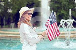Young patriot woman at 4th of July in park