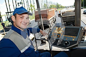 Young paver worker at asphalting