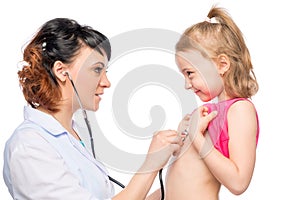 Young pediatrician listens preschooler girl isolated