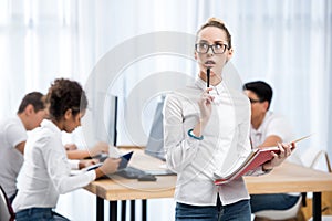 young pensive caucasian student girl in classroom