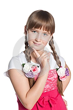 Young pensive girl on the white background