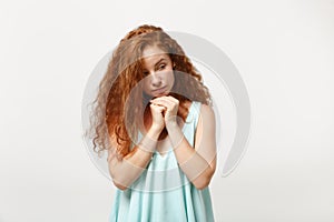 Young pensive redhead woman girl in casual light clothes posing isolated on white background, studio portrait. People