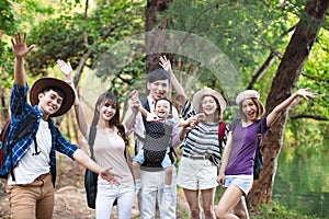 Young people with backpacks hiking together