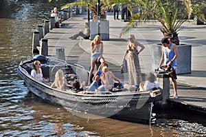 Young people on a boat in Amsterdam