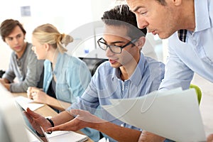 Young people in business training class photo