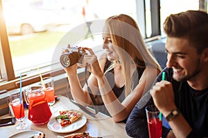 Young people cheering with ropical fruits cocktails - Trendy and party concept.