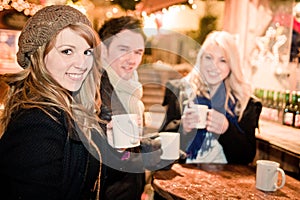 Young People drinking Punch at Christmas Market