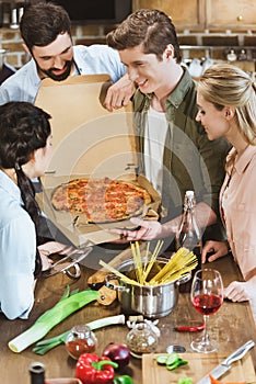 Young people eating pizza