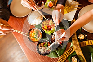 Young people eating in Thai restaurant