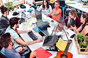 Young people employee workers on computer at urban alternative studio - Human resources and business concept