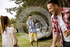 Young people enjoying barbecue party in the nature